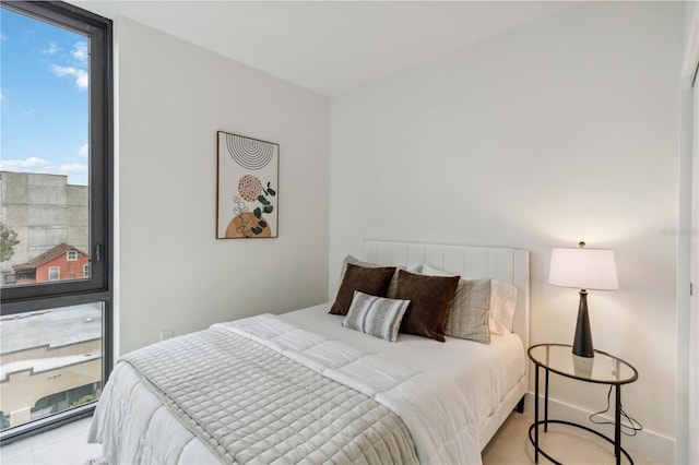 bedroom featuring expansive windows