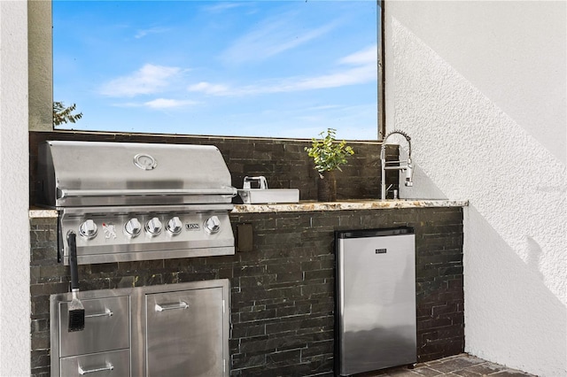 view of patio featuring grilling area and sink