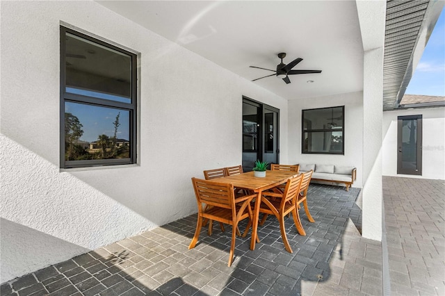 view of patio with ceiling fan and outdoor lounge area