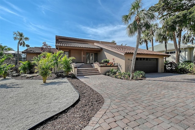 view of front of property with a garage