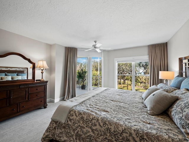 bedroom with light carpet, a textured ceiling, and ceiling fan