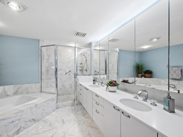 bathroom featuring vanity and shower with separate bathtub