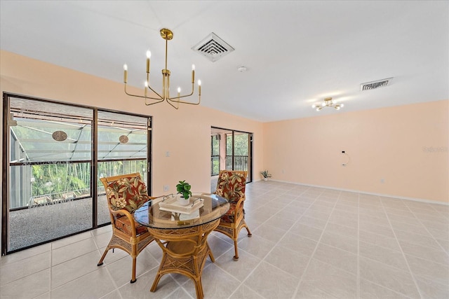 tiled dining room featuring an inviting chandelier