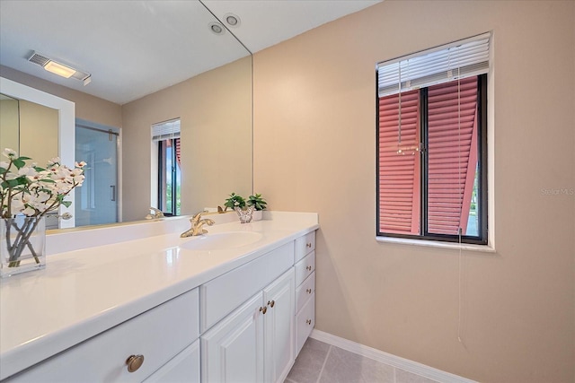 bathroom with vanity, tile patterned flooring, and plenty of natural light