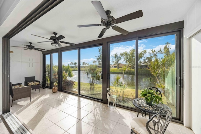 unfurnished sunroom featuring a water view