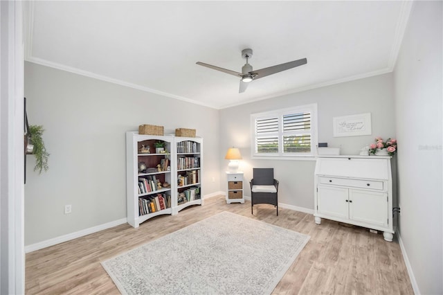 sitting room featuring crown molding, ceiling fan, and light hardwood / wood-style flooring