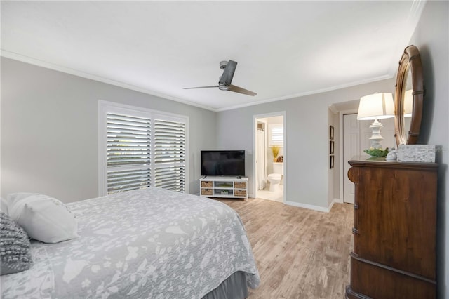 bedroom with crown molding, light hardwood / wood-style floors, ceiling fan, and ensuite bathroom