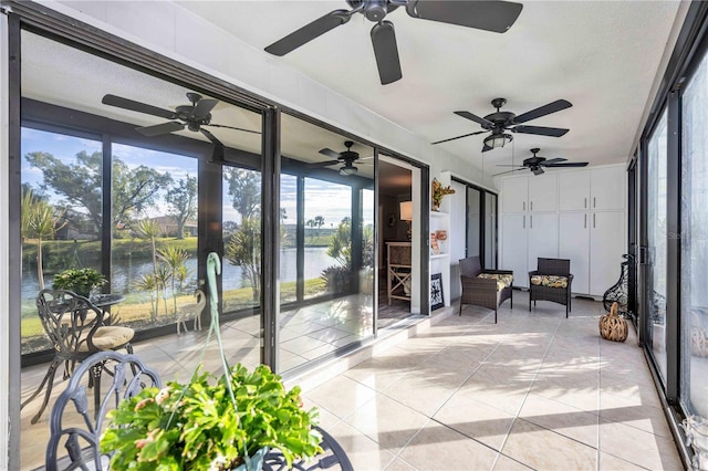 sunroom / solarium with a water view