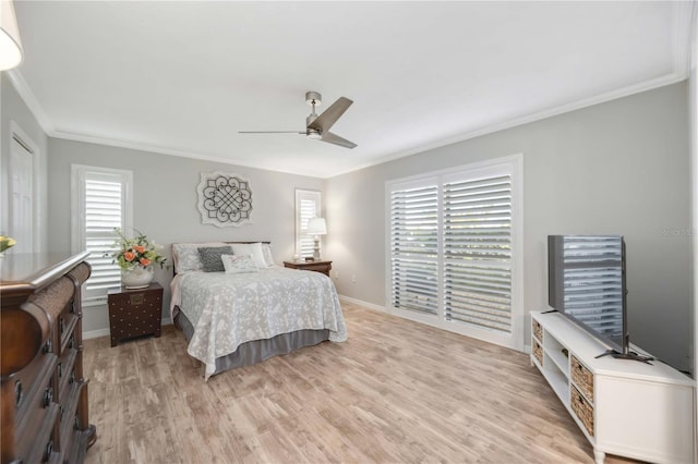 bedroom featuring crown molding, ceiling fan, and light hardwood / wood-style flooring