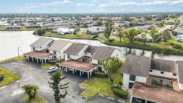 bird's eye view with a water view