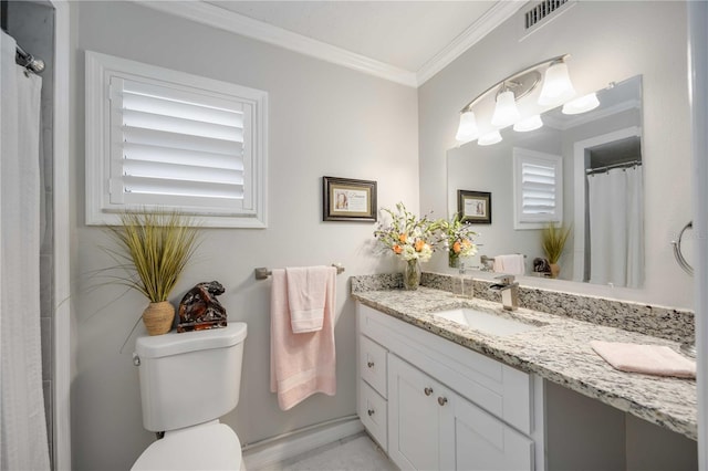 bathroom featuring crown molding, vanity, and toilet