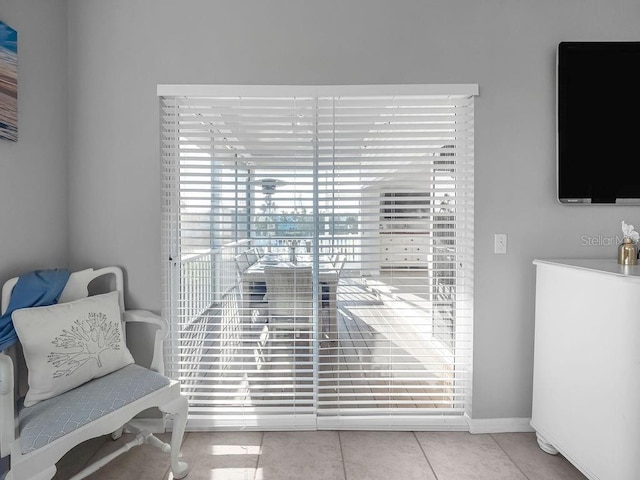 living area with light tile patterned floors