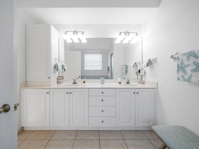 bathroom with vanity and tile patterned flooring