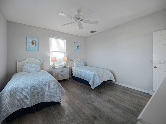 bedroom featuring dark wood-type flooring and ceiling fan