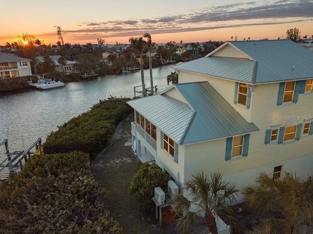 exterior space with a water view