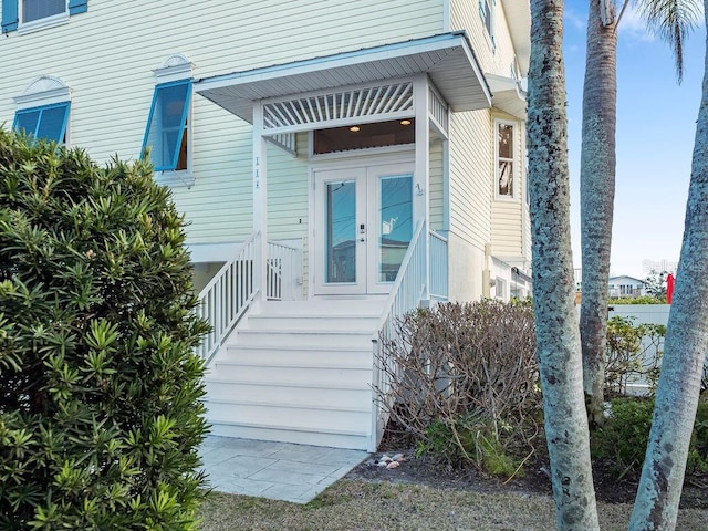 entrance to property featuring french doors