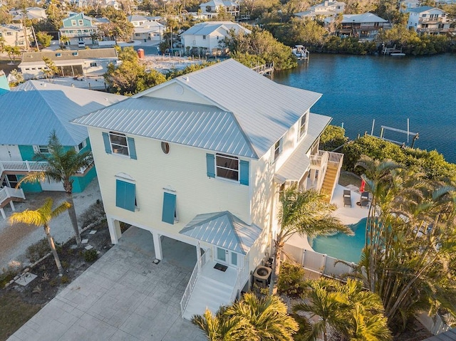 birds eye view of property featuring a water view