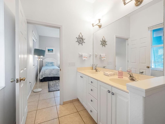 bathroom with tile patterned flooring and vanity