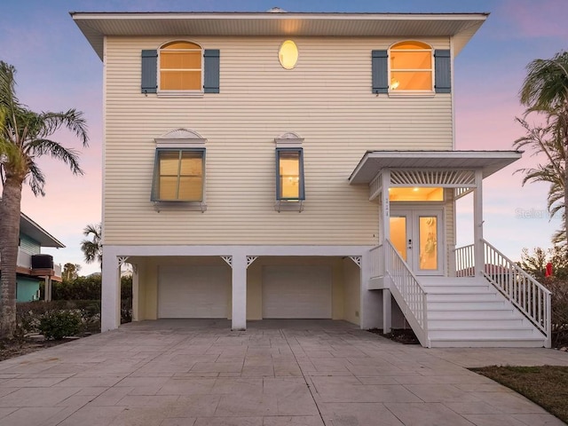 view of front of home featuring a garage and french doors