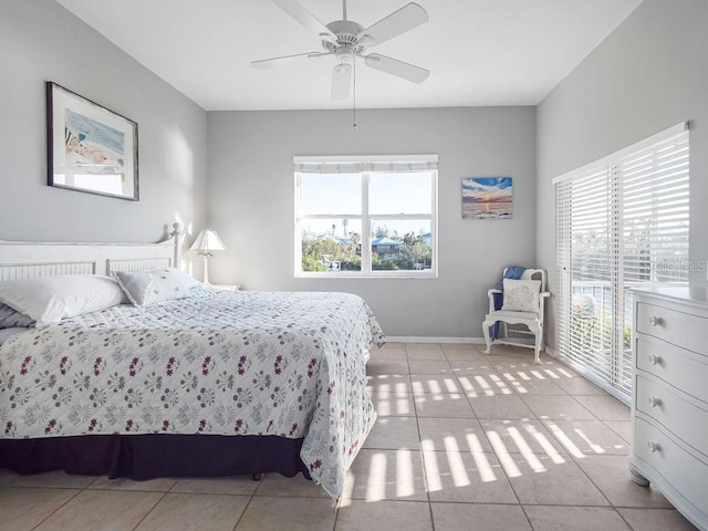 bedroom featuring light tile patterned floors, access to exterior, and ceiling fan