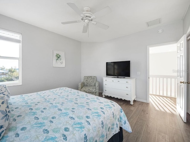 bedroom with hardwood / wood-style flooring and ceiling fan