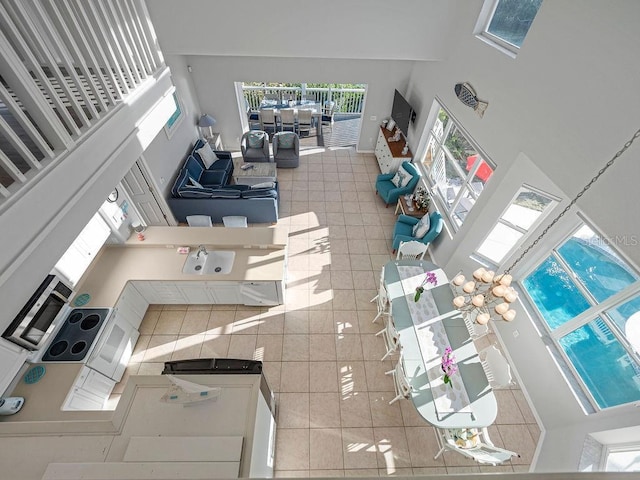 114 Gull Dr, Anna Maria, FL 34216 - tiled living room with a high ceiling