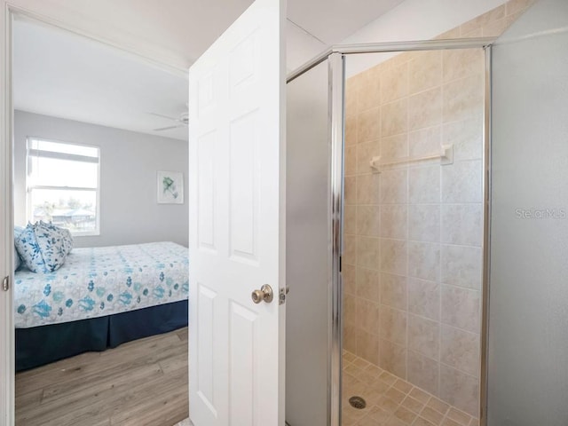 114 Gull Dr, Anna Maria, FL 34216 - full bathroom with ensuite bath, wood finished floors, a stall shower, and a ceiling fan