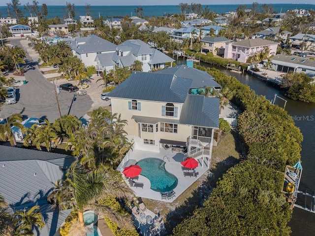 114 Gull Dr, Anna Maria, FL 34216 - aerial view of residential area with a nearby body of water and a pool area
