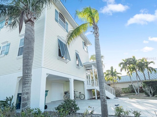 114 Gull Dr, Anna Maria, FL 34216 - view of side of home with stairway
