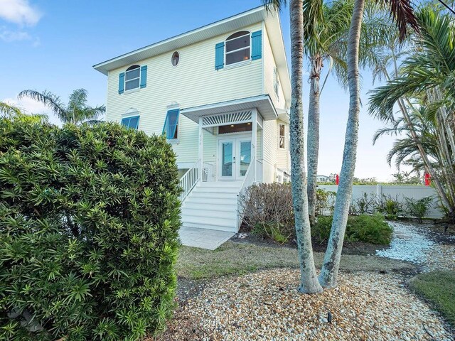 114 Gull Dr, Anna Maria, FL 34216 - back of property with french doors and stairs
