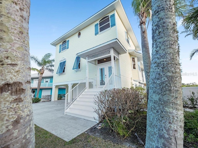 114 Gull Dr, Anna Maria, FL 34216 - rear view of property with french doors