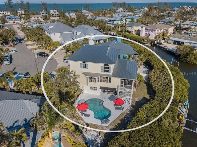 114 Gull Dr, Anna Maria, FL 34216 - aerial perspective of suburban area with a nearby body of water and a pool