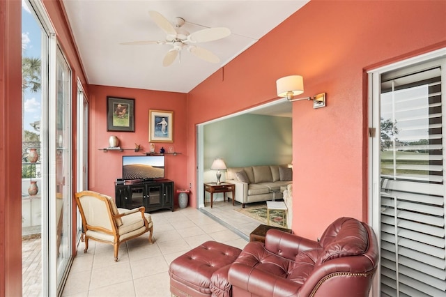 sunroom / solarium featuring ceiling fan