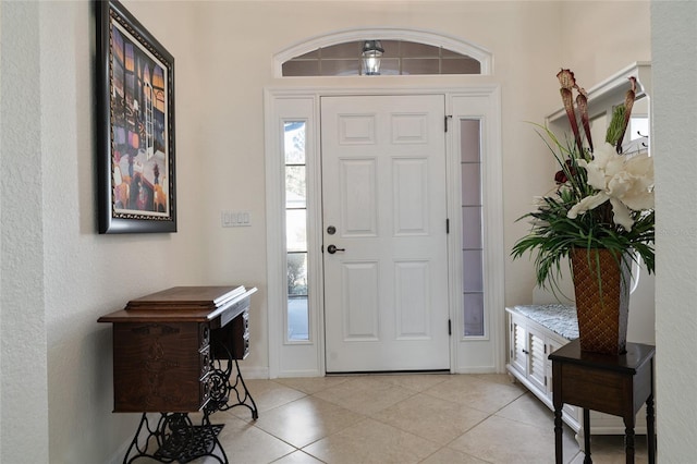 entrance foyer featuring light tile patterned flooring