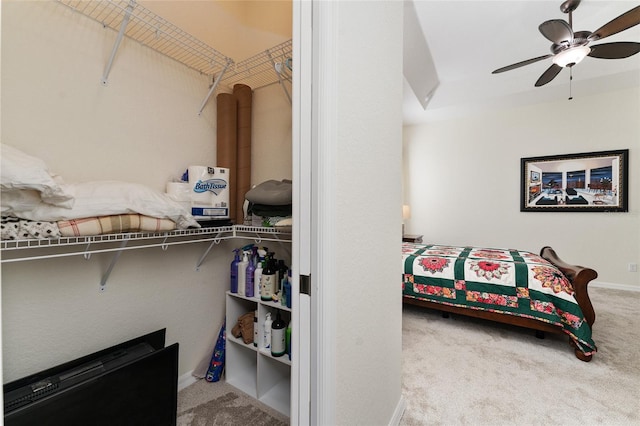 bedroom with light carpet and ceiling fan