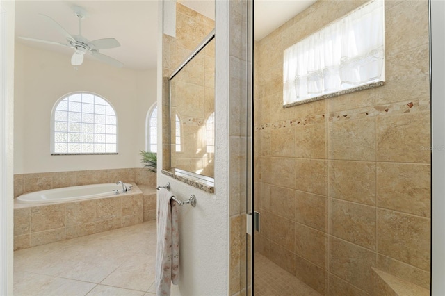 bathroom featuring ceiling fan, plenty of natural light, tile patterned floors, and separate shower and tub