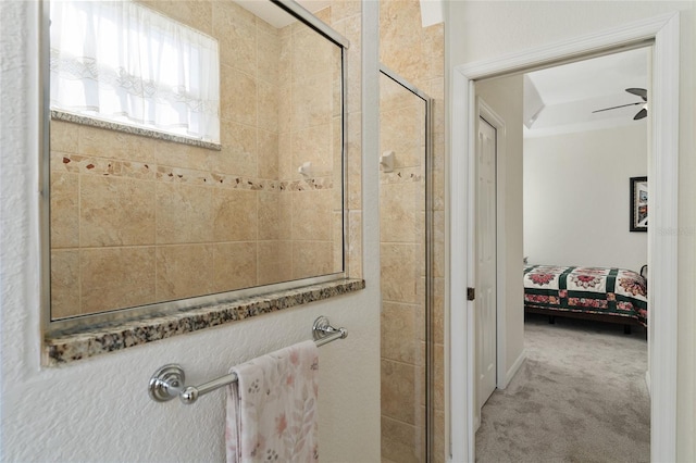 bathroom featuring an enclosed shower and ceiling fan