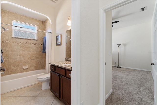 full bathroom featuring tile patterned flooring, vanity, toilet, and shower / bath combo with shower curtain