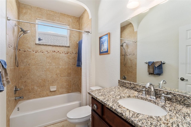 full bathroom featuring shower / tub combo with curtain, vanity, and toilet