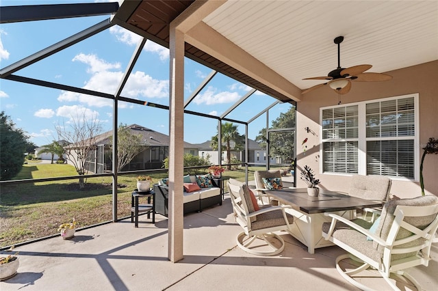 view of patio / terrace featuring a lanai, outdoor lounge area, and ceiling fan