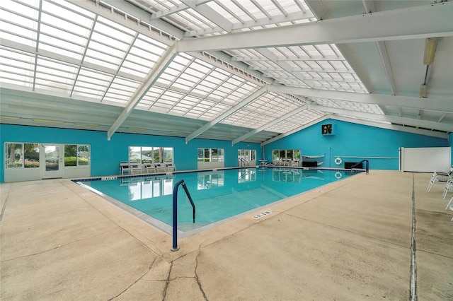 view of swimming pool with a lanai and a patio area