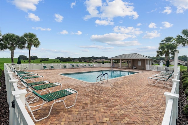 view of swimming pool with a patio