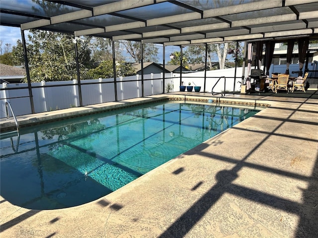 view of pool with a lanai and a patio area