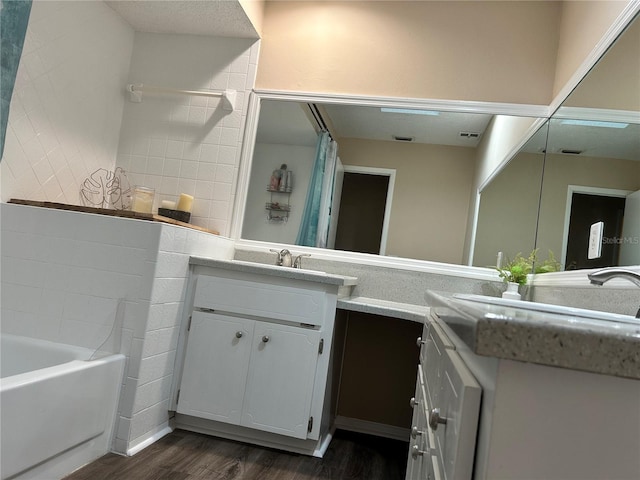 bathroom featuring vanity and wood-type flooring