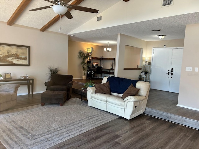 living room featuring vaulted ceiling with beams, ceiling fan with notable chandelier, a textured ceiling, and dark hardwood / wood-style flooring