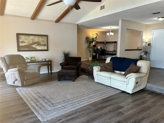 living room with lofted ceiling with beams, ceiling fan with notable chandelier, a textured ceiling, and dark hardwood / wood-style flooring