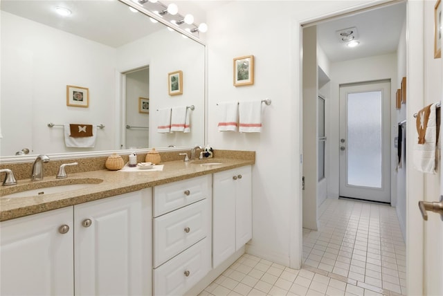 bathroom with vanity and tile patterned floors