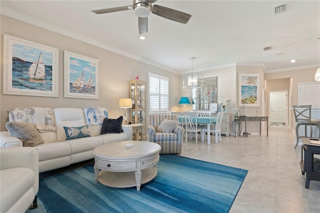 living room with crown molding, light tile patterned floors, and ceiling fan