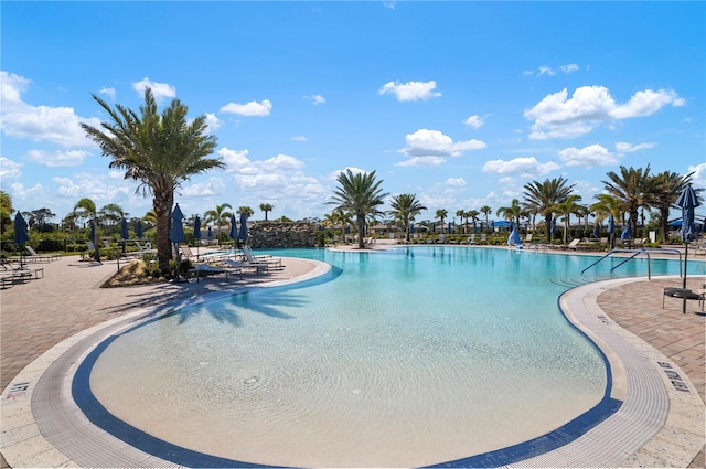 view of swimming pool featuring a patio area