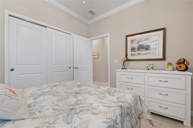 bedroom with crown molding, light carpet, and a closet